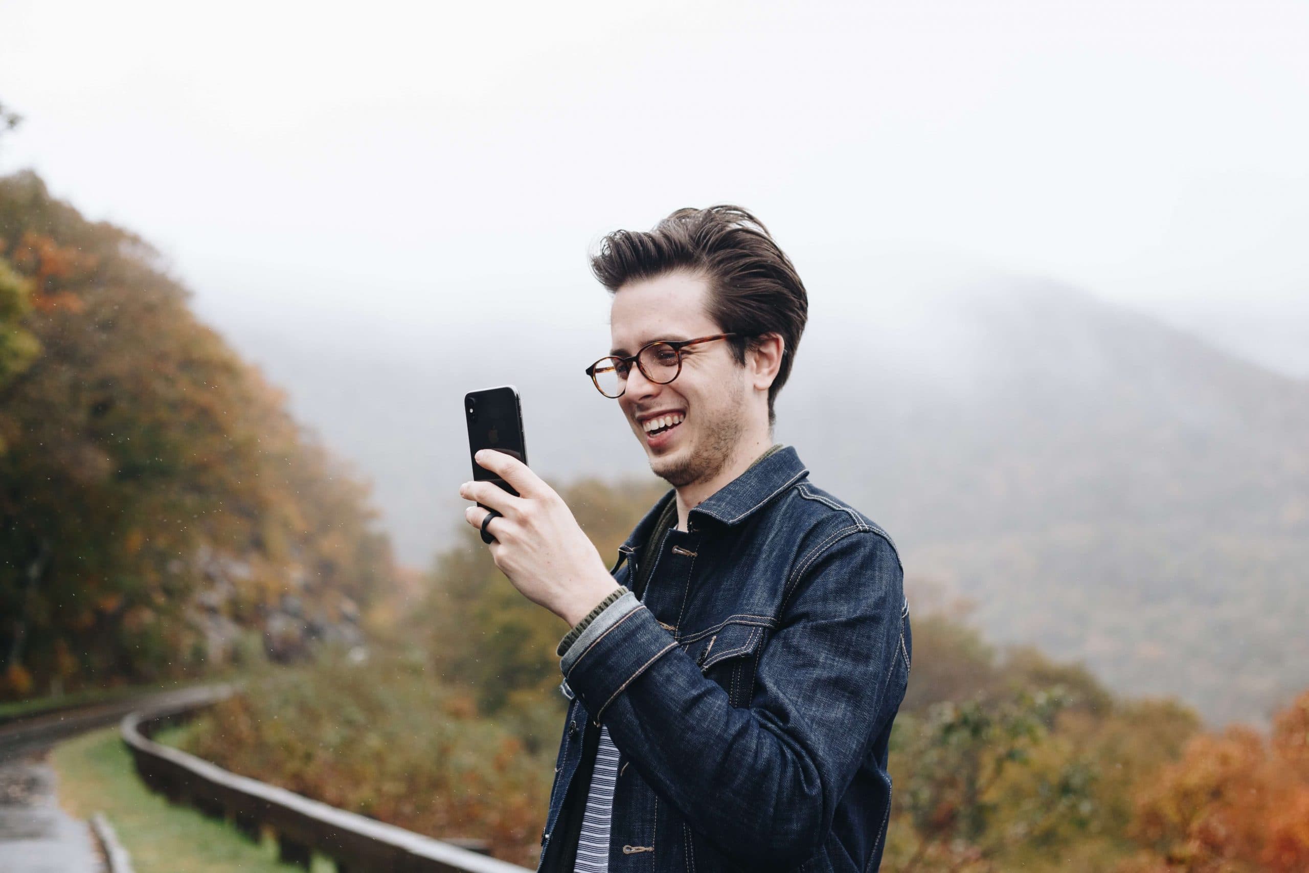 A person taking a photograph using a smartphone.